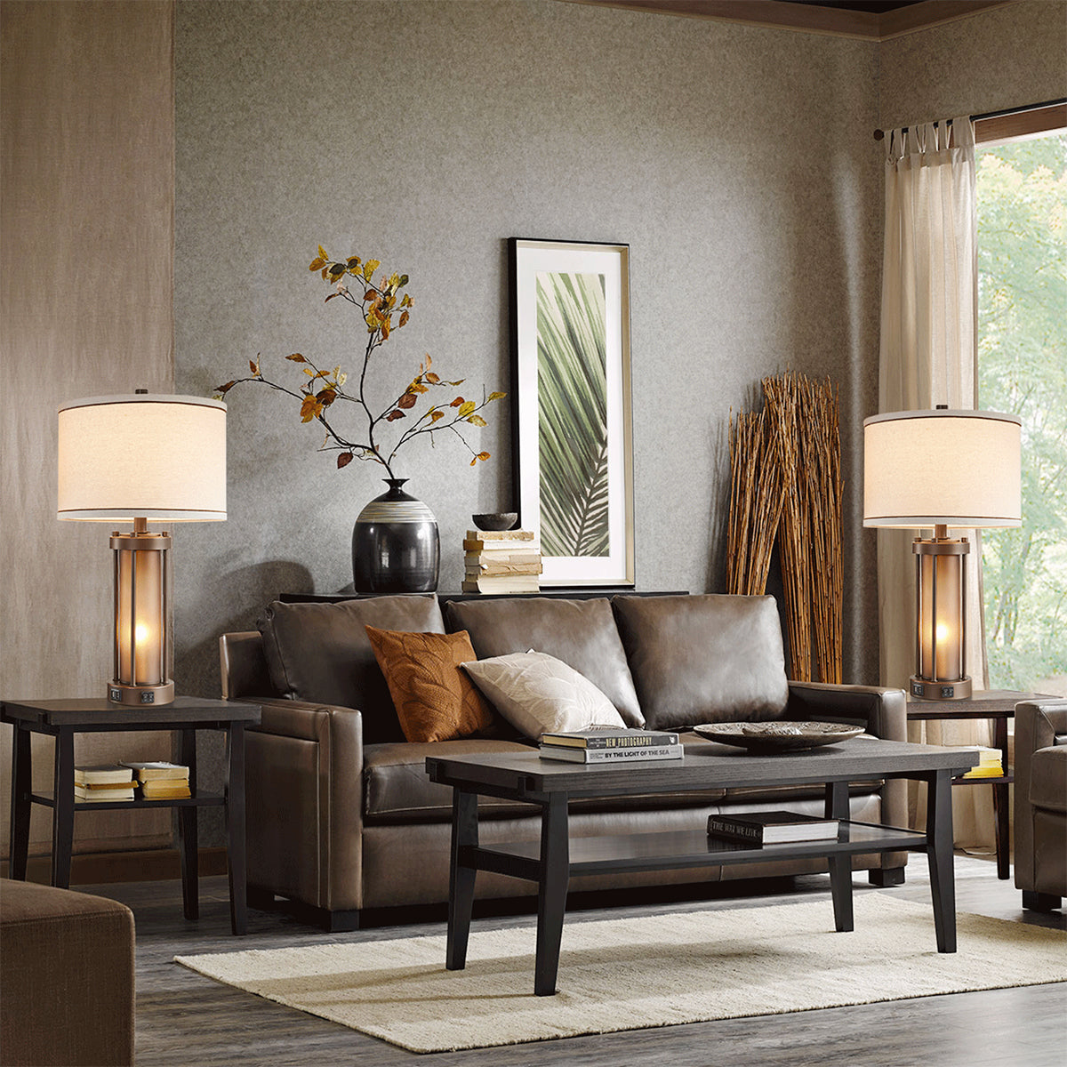Set of two bronze table lamps decorating a modern living room with elegant home furnishings.