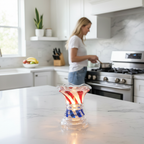 Crystal glass fragrance oil warmer glowing on kitchen counter