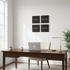 Four 12x12 inch black framed motivational canvas prints in home office, true to scale