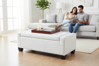 White tufted storage ottoman used as coffee table in living room