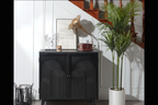 Modern black accent cabinet styled in living room