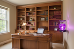 Purple tie dye ball wall burner plugged into home office wall outlet glowing purple