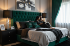 Table lamps in black silver and green bedroom scene with couple